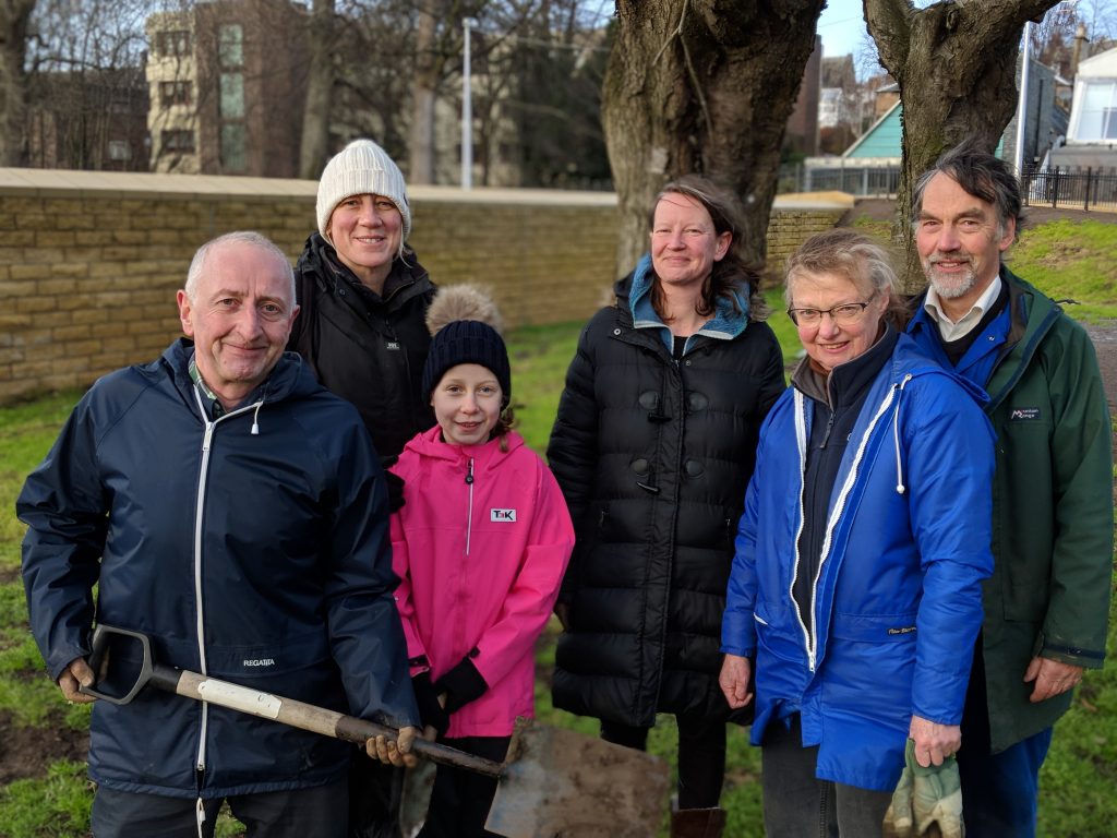 Group of people who were planting bulbs